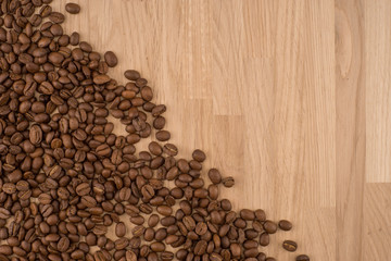 Coffee beans on wood background