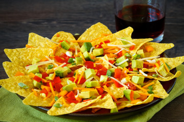 Homemade nachos with cheese and vegetables  © DIA
