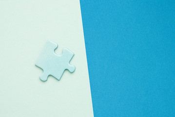 isolated blue Puzzle piece on blue paper background