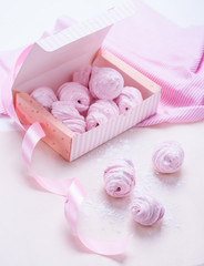 Berry marshmallow in a gift box on a pink background