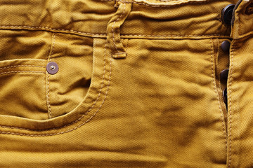 Part of yellow jeans