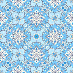 Filigree seamless beige textura on blue.