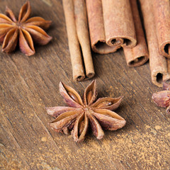 cinnamon sticks and  star anise on wooden background