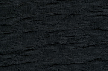 Black fabric background wave like close up