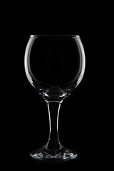 Empty wine  glass on black background  in studio