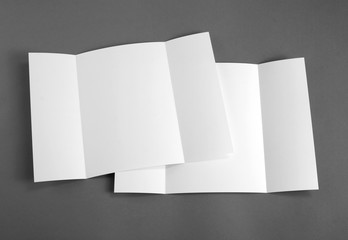 Blank gate fold brochure on grey to replace your design.