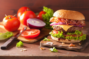 bacon cheese burger with beef patty tomato onion