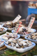 Raw seafood selling on market in Japan