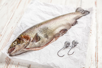 Fresh trout on white wood