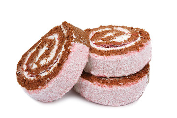Slices of sweet roll cake isolated on white background