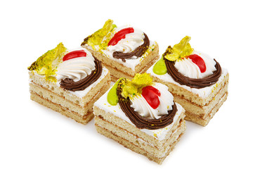 Obraz na płótnie Canvas biscuit white cake decorated with cream flowers