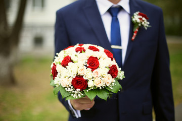 Groom with bouquet