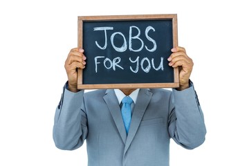 Businessman holding black board 