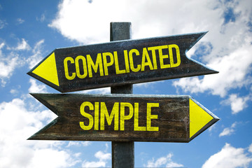 Complicated - Simple signpost with sky background