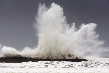 big waves breaking on Plentzia breakwater