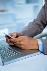 Businessman on his smartphone  