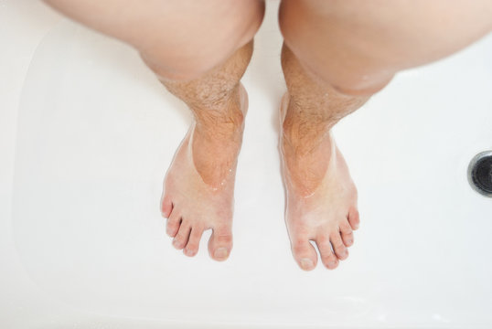 Photo of man's feet in the shower