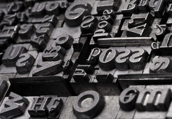 Metal Letterpress Types.
A background from many historic typographical letters in black and white with white background.
 - obrazy, fototapety, plakaty