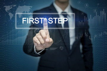 Businessman hand touching FIRST STEP button on virtual screen