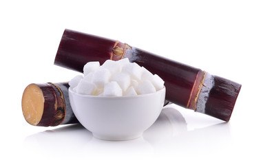 sugarcane and sugar cube on white background