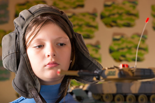 Girl Playing Toy Military Tank