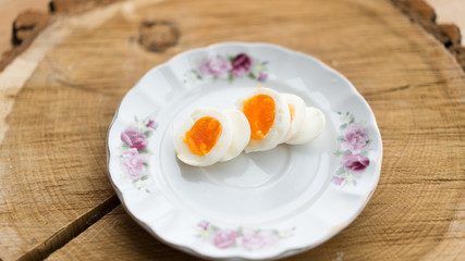 Sliced boiled egg. Breakfast healthy food on porcelain plate.