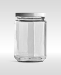 Empty glass jar and white cap in front view isolated on white background. Clipping path.