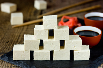 Tofu cheese, cut into cubes, with marinated ginger and soy sauce. Traditional cuisine. Selective focus.