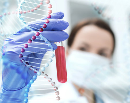 Close Up Of Scientist Holding Test Tube In Lab