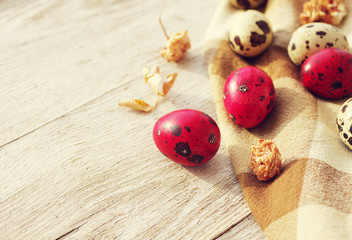 Easter eggs on an old wooden background. Easter quail eggs