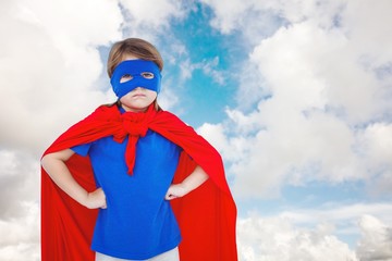 Composite image of masked girl pretending to be superhero