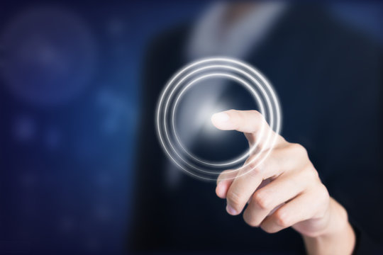 Close up of businessman touching digital screen with finger