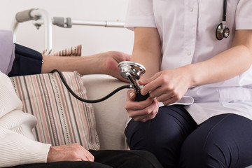 Doctor measuring blood pressure