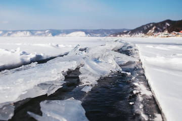 Fototapeta na wymiar view over the frozen snow-covered mountains and Lake Baikal