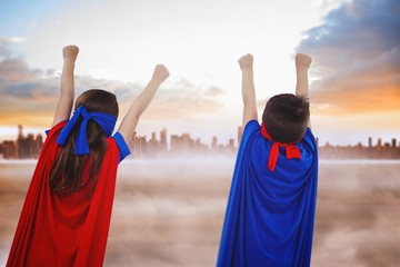 Composite image of masked kids pretending to be superheroes