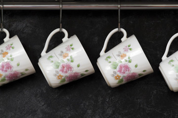 Tea cups on the kitchen wall