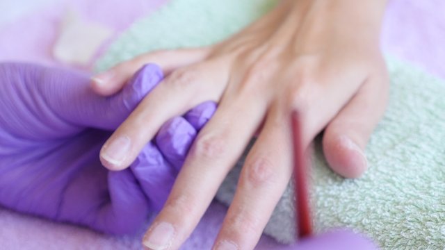 French nail manicure white paint and lacquer applying on in salon 4K 2160p 30fps UltraHD footage - Nail enamel professional apply on French finger tips