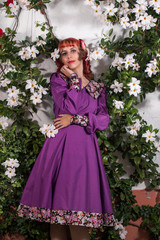 Fototapeta premium young redhead girl on a retro vintage dress