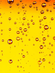 Water drops on glass of beer. Close up.