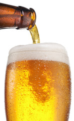 The process of pouring beer into the glass.