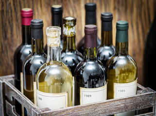 Wine bottles in a wooden crate . © volff