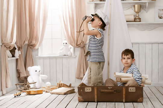 Boys in the image of sailors playing in her room