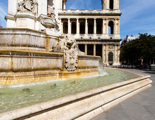 Color DSLR stock image of Church of Saint-Sulpice, Paris, France in the St. Germain district. Fountain in the foreground 
