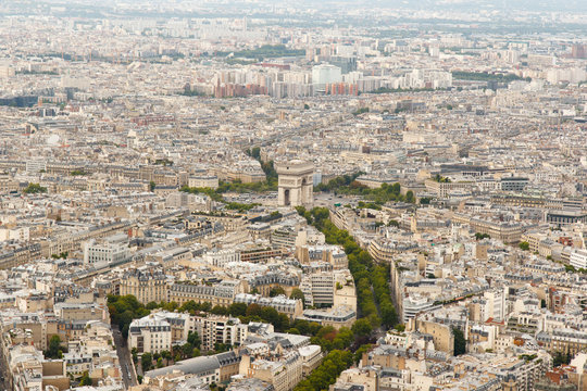 Color DSLR wide angle stock skyline of Paris, France, with the Arc de Triomphe at the center. Urban scene shot from top of Eiffel Tower. Horizontal with copy space for text.
