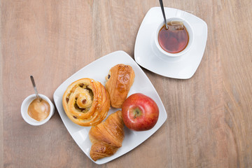 Table set for high tea with cookies and pastries