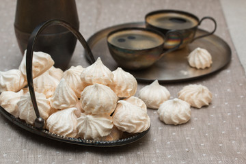 Meringue on the metal plate. Vintage style.
