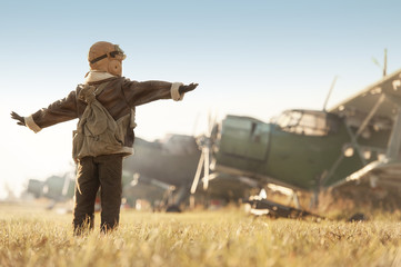 Portrait of a young aviator parked aircraft