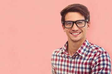 Composite image of young businessman smiling