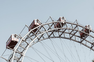 Retro Filter Of Fun Park Ferris Wheel Against Blue Sky In Vienna Prater Park