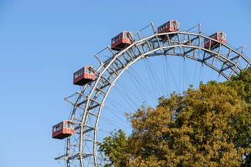 Deurstickers Fun Park Ferris Wheel Against Blue Sky In Vienna Prater Park © radub85
